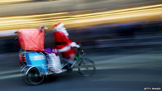 Father Christmas on a bike