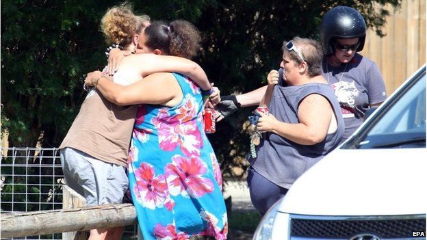 Local people outside the house in Cairns (19 Dec 2014)