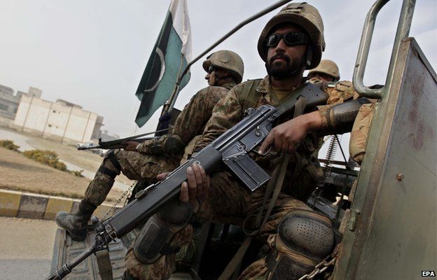 Pakistan army soldiers outside the army public school attacked by the Taliban in Peshawar 18 December 2014