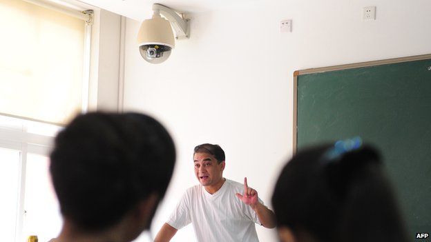 Prominent Uighur academic Ilham Tohti lectures in a classroom in Beijing on 12 June, 2010
