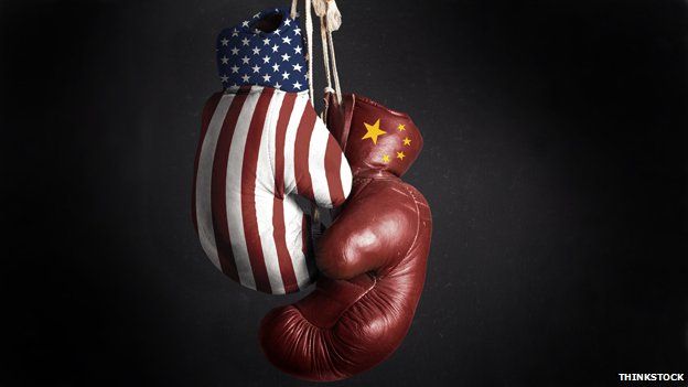 Two boxing gloves - one with the US flag and the other with the Chinese flag