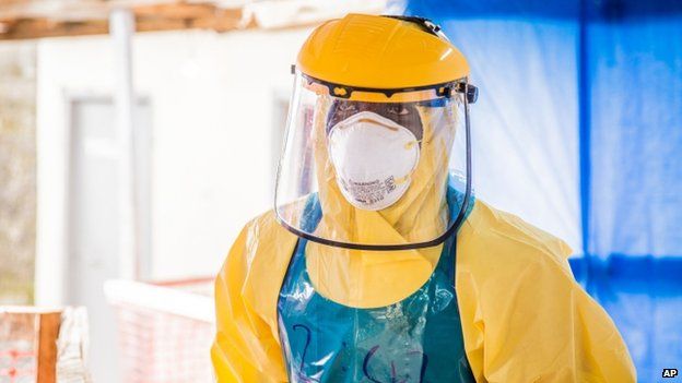 A healthcare worker in protective gear is seen at an Ebola treatment centre in the west of Freetown, Sierra Leone, in October 2014