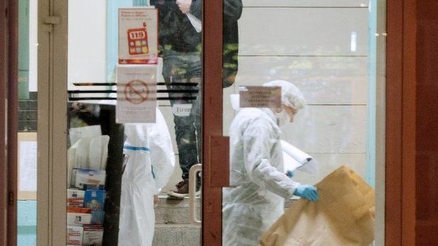 Forensic police collect evidence inside Joue les-Tours' police station. Photo: 20 December 2014