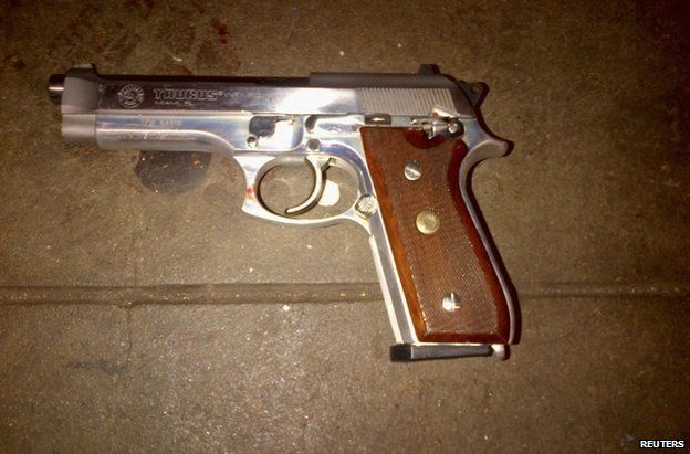 A silver semi-automatic Taurus firearm, which police said was recovered on the subway platform near the body of 28-year-old gunman Ismaaiyl Brinsley