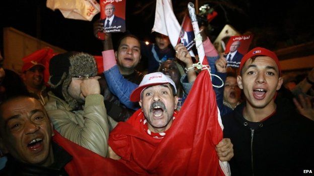 Supporters of the Presidential candidate Beji Caid Essebsi, leader of the Nidaa Tounes party shout slogans celebrate the first results of the Tunisian elections