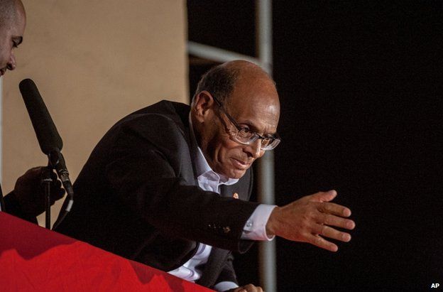 Moncef Marzouki greets supporters in Tunis, 21 December