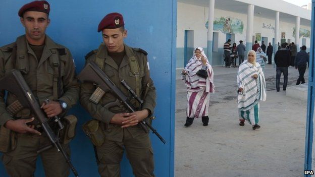 Soldiers stand guard during Tunisia's historic presidential elections