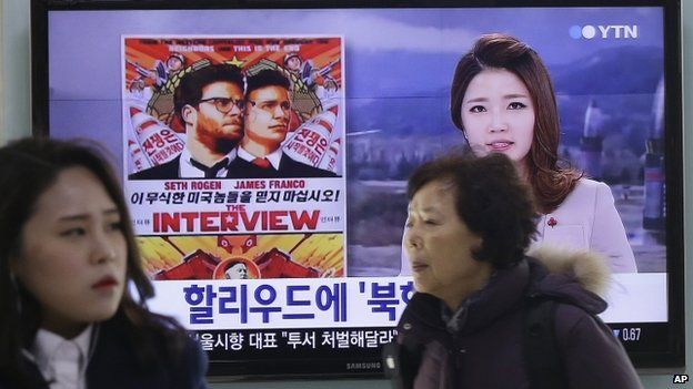 TV screen in Seoul showing news report of film The Interview. 22 Dec 2014