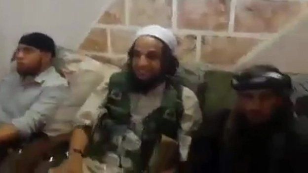 Frame from IS video appearing to show IS fighters discussing obtaining female slaves