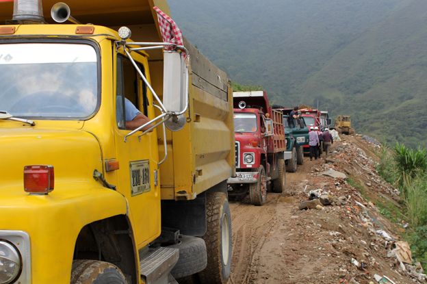 Lorries carry construction waste to parts of the dump
