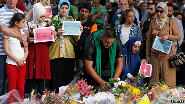 Members of Sydney's Islamic community lay flowers at the memorial