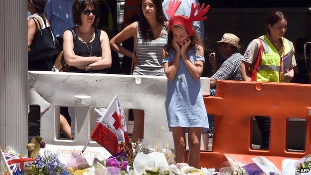 Young girl at memorial to siege victims