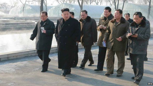 Undated photo of North Korean leader Kim Jong-un visiting a catfish farm