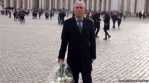 Mehmet Ali Agca holding a wreath of flowers on St. Peter's square in The Vatican from Adnkronos TV on 27 December 2014