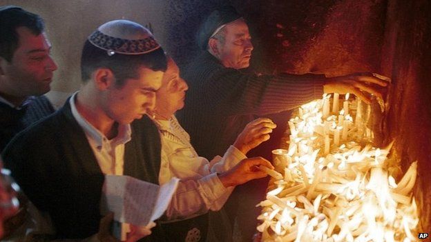 Jewish pilgrims light candles at a shrine dedicated to Rabbi Yaakov Abuhatzeira in Damanhur, Egypt (1999)