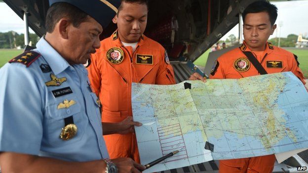 Western Indonesia Air Force operation commander Air Vice Marshal Agus Dwi Putranto (L) briefs crews before a search and rescue operation in Jakarta - December 30