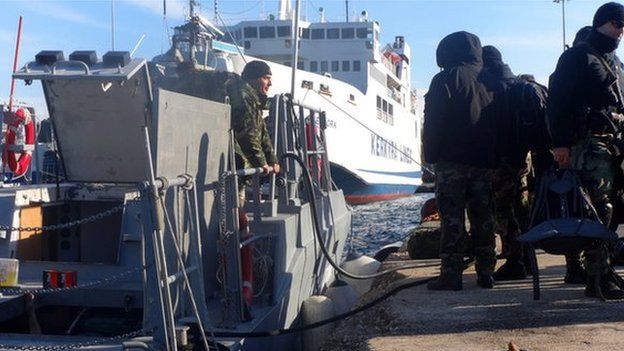 Armed special missions officers of the Greek coast guard set off from Corfu harbour for waters off the Ionian island of Othoni, responding to a distress signal from Moldovan-registered freighter "Blue Sky M" in the area, in Corfu, Greece, 30 December 2014