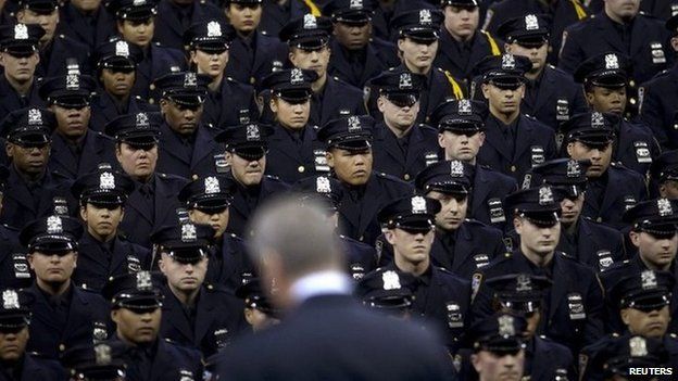 New York Mayor Bill de Blasio speaks from the podium to the New York City Police Academy Graduating class in New York December 29, 2014