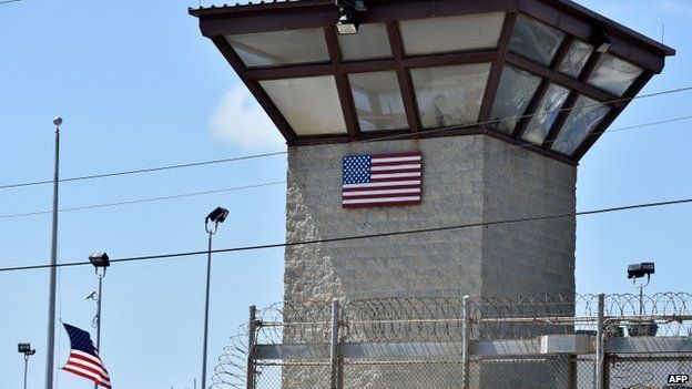 US military shows the razor wire-topped fence and the watch tower of "Camp 6" detention facility at the US Naval Station in Guantanamo Bay, Cuba, on 8 April 2014