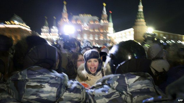 A woman screams during a rally in support of Russian opposition leader Alexei Navalny and his brother Oleg Navalny in central Moscow on 30 December 2014