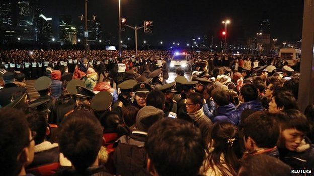 Police control the site after a stampede occurred during a New Year"s celebration on the Bund, a waterfront area in central Shanghai, 1 January 2015.