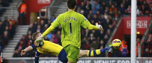 Per Mertesacker lunged but could not keep out Sadio Mane's curled effort as Szczesny raced back