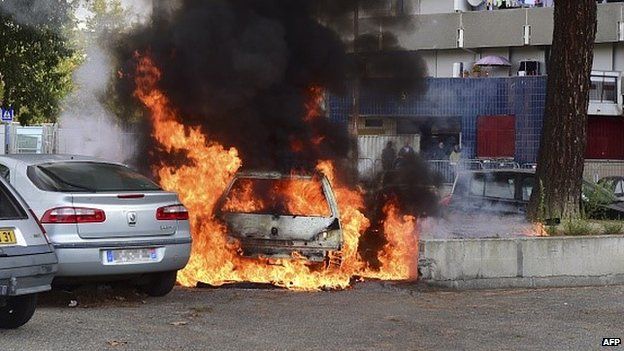 A car burns on a council estate in France in 2014