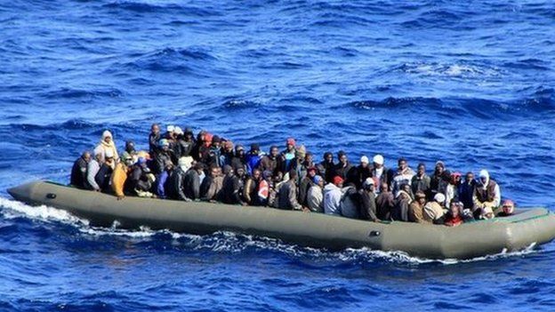 One of six makeshift boats filled with migrants which was spotted by an Italian Navy ship, in the Mediterranean sea near Lampedusa