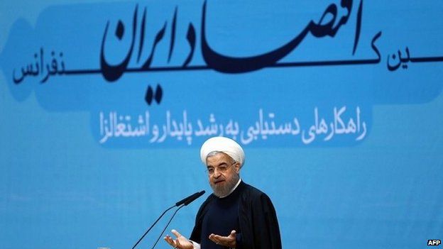 Hassan Rouhani addresses an economic conference in Tehran (4 January 2014)