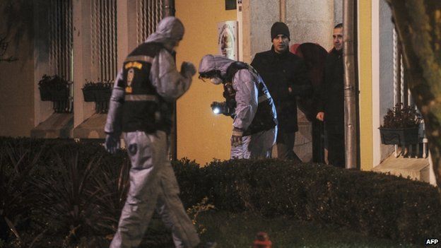 Crime scene investigation officers search for evidence after a female suicide bomber was killed on 6 January 2015,