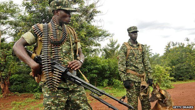 Ugandan soldiers under African Union (AU) command patrol as part of a mission to combat Lord's Resistance Army (LRA) rebels in Obo in the Central African Republic (CAR) on 13 May 2014