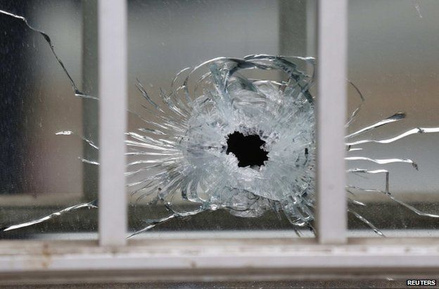 A bullet impact at the Charlie Hebdo office in Paris, 7 January