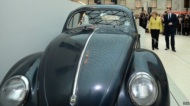 David Cameron and Angela Merkel inspect a 1953 Volkswagen Beetle during a visit to the British Museum in central London