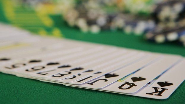 Playing cards and poker chips (c) Getty Images