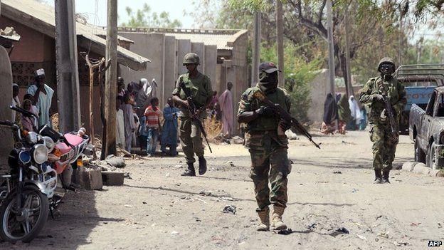 Nigerian troops patrolling in the streets of the remote northeast town of Baga, Borno State on 30 April 2013