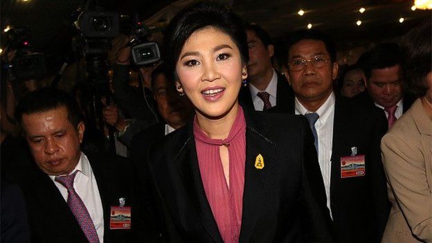 Yingluck Shinawatra, Thailand's former prime minister, center, arrives at Parliament House in Bangkok, Thailand, on Friday, Jan. 9, 2015.