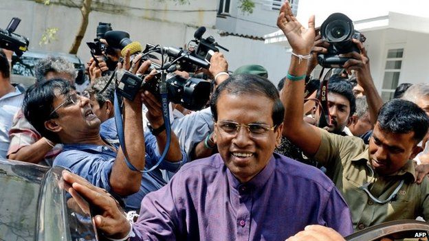 Sri Lanka's newly elected president Maithripala Sirisena leaves the opposition leader's office after meeting with political leaders who supported him, in the capital Colombo on January 9,