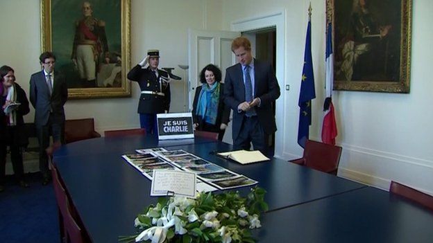 Prince Harry signing book of condolence