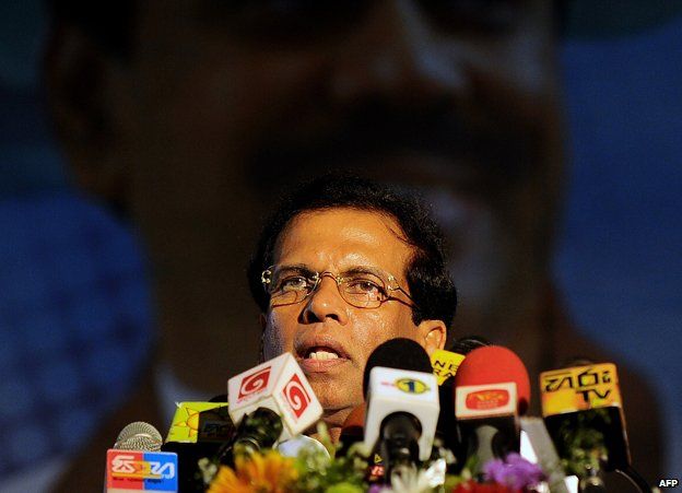 Sri Lanka's Health Minister Maithripala Sirisena addresses health workers in Colombo on November 21, 2014, at a meeting marking the recruitment of new employees