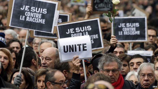 Thousands walk during a tribute to the victims of the Paris attacks in Toulouse, Southern France, 10 January 2014