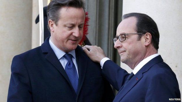 French President Francois Hollande (R) welcomes Britain's Prime Minister David Cameron (L) at the Elysee Palace