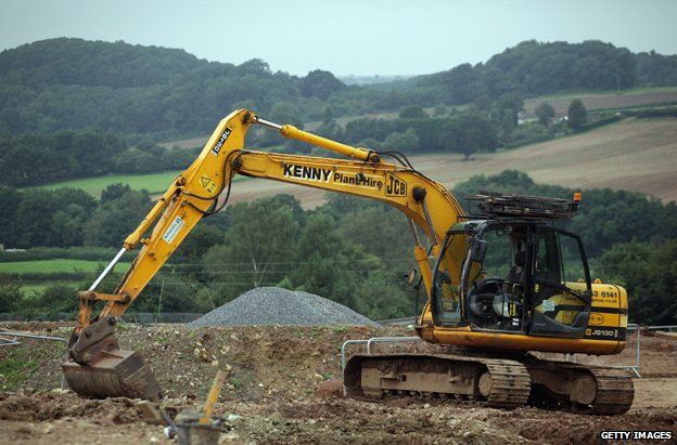 Big digger on edge of countryside