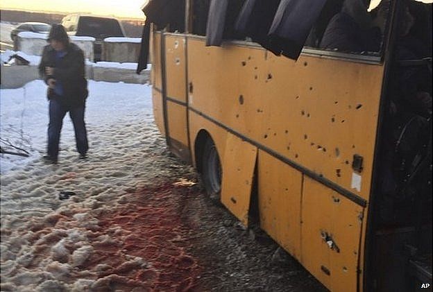 Snow covered with blood by a bus destroyed by a shell at the checkpoint near the town of Volnovakha. 13 Jan 2015