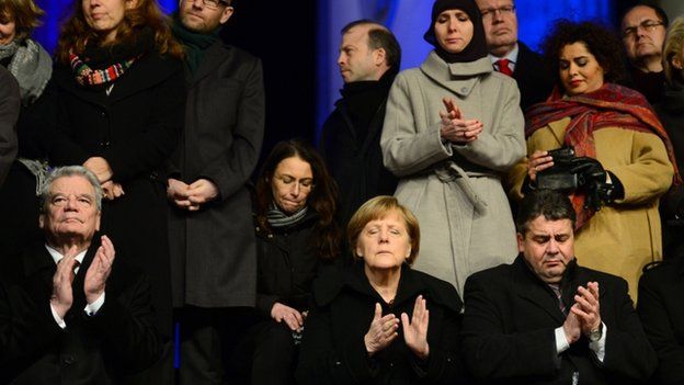 Chancellor Angela Merkel and President Joachim Gauck (left) attend the rally. 13 Jan 2015