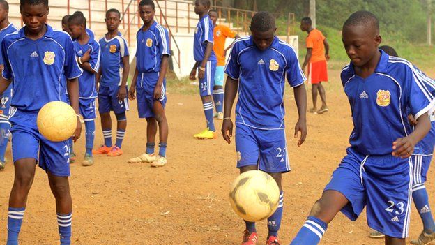 Footballers at the Cyrille Domoroud football academy in Ivory Coast