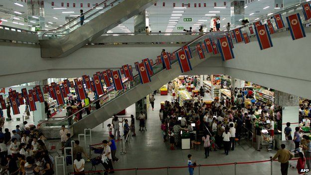 Customers shopping at a supermarket in Pyongyang