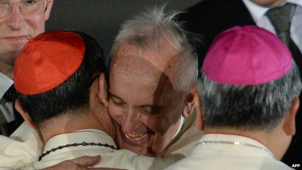 Pope Francis is greeted by Philippine Cardinal Luis Tagle during a welcome ceremony shortly after arriving at a military air base in Manila (15 January 2015)