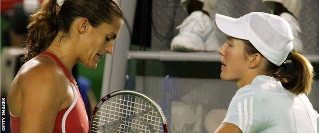 Amelie Mauresmo consoles Justine Henin after the Belgian's retirement from the Australian Open final in 2006