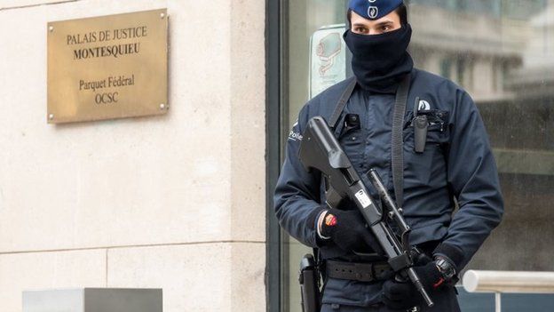 A policeman guards the Belgian Federal Prosecutor's office in Brussels, 16 January 2015