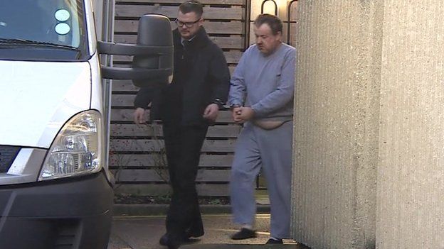 Andrew Main, pictured in grey, led to security van